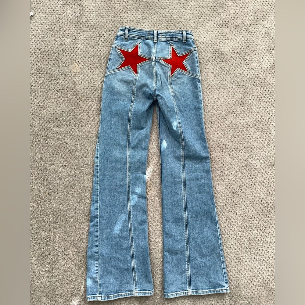 FREE PEOPLE- We The Free FireCracker Flare Jeans. Red Star